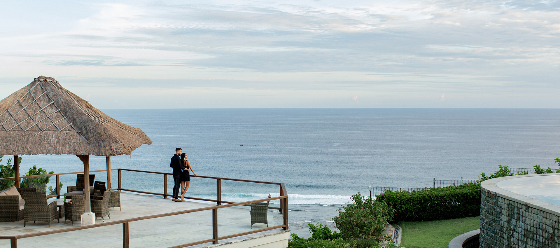 Beautiful couple look at the ocean